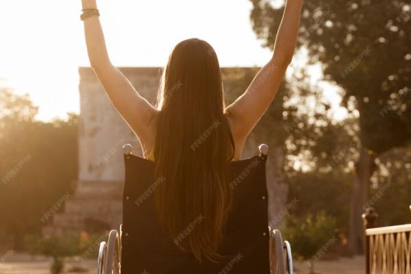 A woman with disability celebrating 